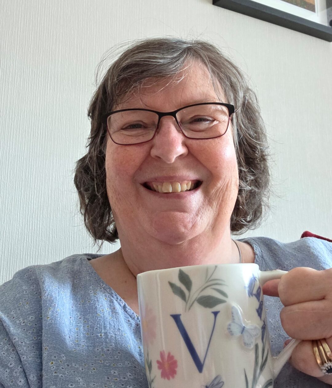 Valerie Crozier-Nicholl resting with a cup of tea at home